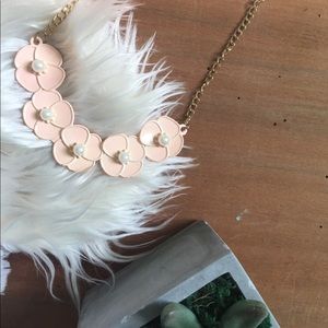 A pink flower necklace 🌸